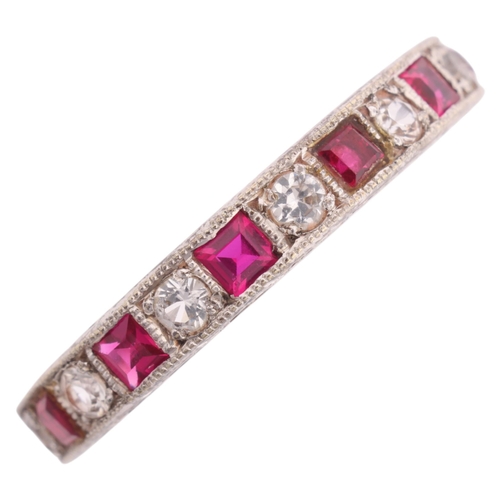 1215 - A 9ct white gold ruby and cubic zirconia full eternity ring, Charles Green & Son Ltd, Birmingham 196... 