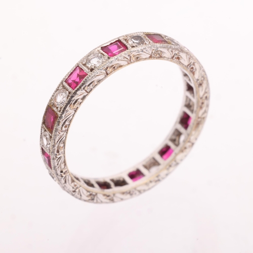 1215 - A 9ct white gold ruby and cubic zirconia full eternity ring, Charles Green & Son Ltd, Birmingham 196... 