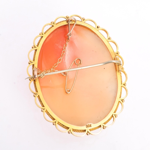 1239 - A Vintage 9ct gold shell cameo brooch, the oval panel relief carved depicting Nyx, Goddess of Night,... 