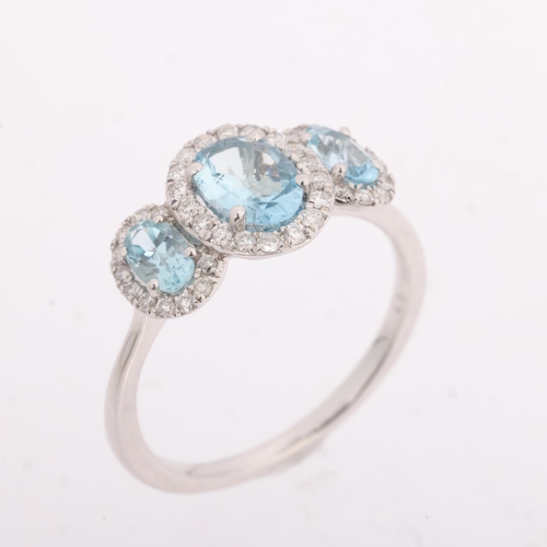1241 - A 9ct white gold aquamarine and diamond triple cluster ring, set with oval mixed-cut aquamarines and... 