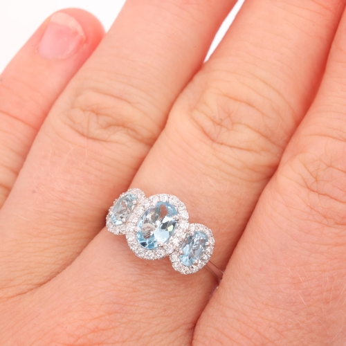 1241 - A 9ct white gold aquamarine and diamond triple cluster ring, set with oval mixed-cut aquamarines and... 