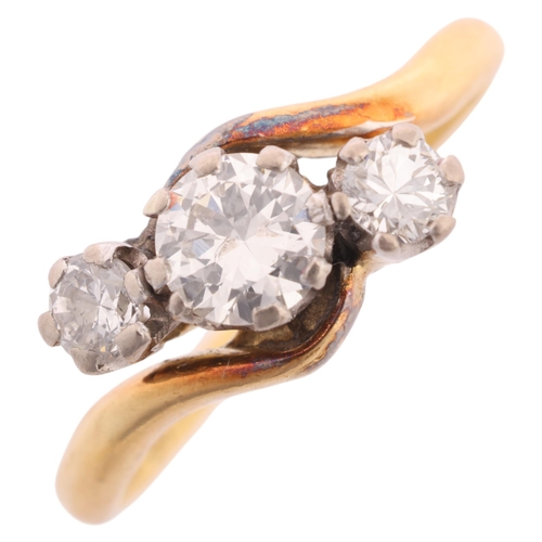 1243 - An Antique 18ct gold three stone diamond crossover ring, claw set with round transitional-cut diamon... 