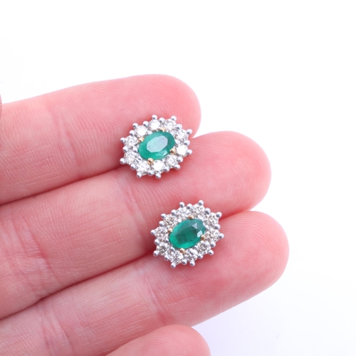 1245 - A pair of 9ct gold emerald and diamond cluster stud earrings, set with oval mixed-cut emeralds and m... 