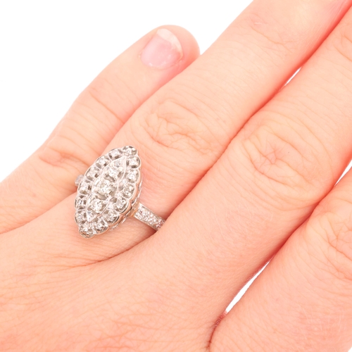 1246 - A diamond marquise cluster ring, set with modern round brilliant-cut diamonds and single-cut diamond... 
