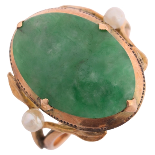 1250 - A Chinese 18ct gold jade and pearl dress ring, set with oval low cabochon jade, jade measures approx... 
