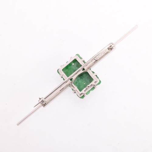 1251 - An 18ct white gold jade panel bar brooch, maker SU Ltd, the rectangular panel with pierced carved an... 