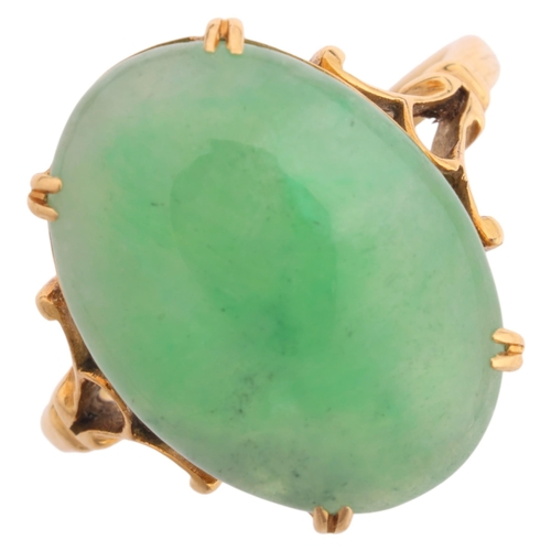 1252 - A Chinese 18ct gold jade dress ring, set with oval cabochon jade, jade measures approx 15.0 x 10.9 x... 