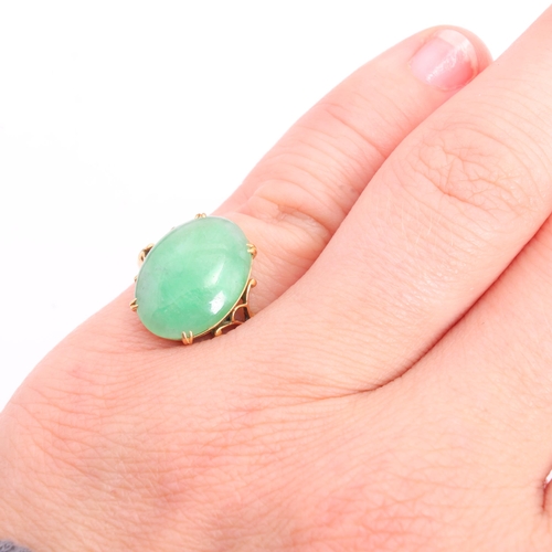 1252 - A Chinese 18ct gold jade dress ring, set with oval cabochon jade, jade measures approx 15.0 x 10.9 x... 