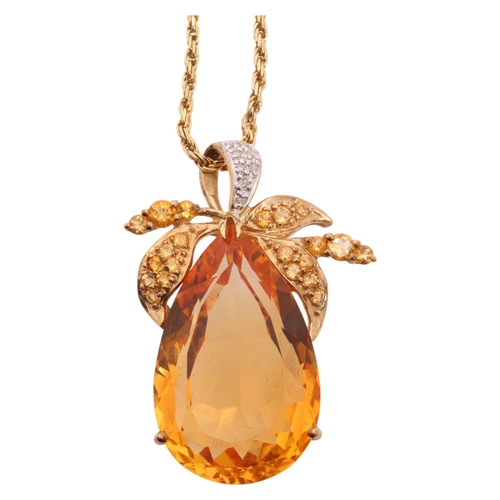 1255 - A 9ct gold citrine and diamond floral pendant necklace, set with pear and round-cut citrines, with s... 