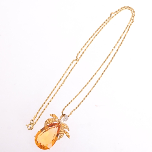 1255 - A 9ct gold citrine and diamond floral pendant necklace, set with pear and round-cut citrines, with s... 