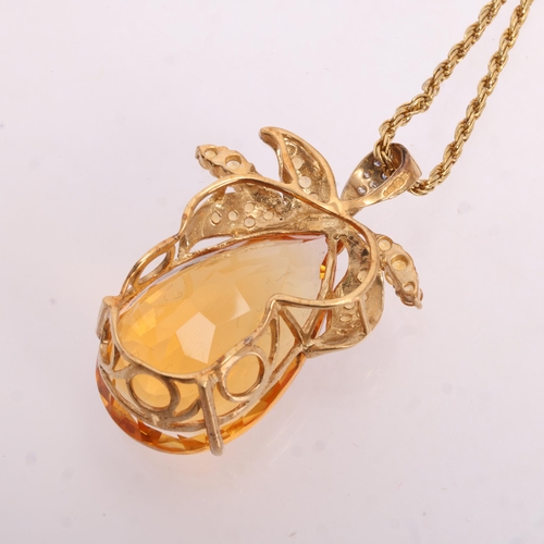1255 - A 9ct gold citrine and diamond floral pendant necklace, set with pear and round-cut citrines, with s... 