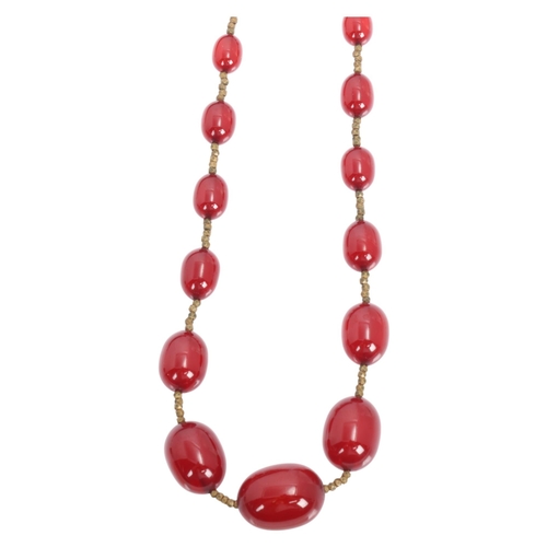 1256 - A Vintage single-row graduated cherry amber bead necklace, amber measures 20.7-9.3mm, 60cm, 27.4g