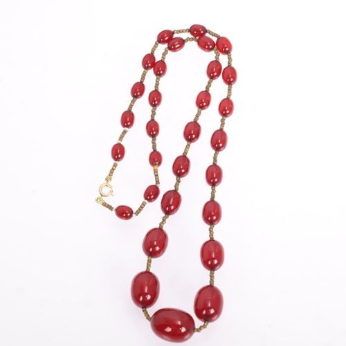 1256 - A Vintage single-row graduated cherry amber bead necklace, amber measures 20.7-9.3mm, 60cm, 27.4g
