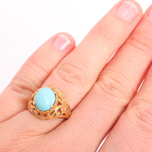 1295 - A Continental 18ct gold turquoise dress ring, set with oval cabochon turquoise and pierced foliate s... 