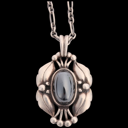 1454 - GEORG JENSEN - an Art Deco style Danish sterling silver hematite Pendant Of The Year 2000, on origin... 