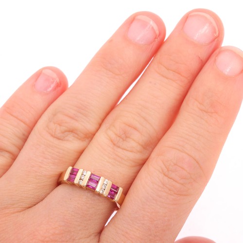 1132 - A 14ct gold ruby and diamond half hoop ring, bar set with rectangular step-cut rubies and modern rou... 