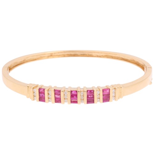1133 - A 14ct gold ruby and diamond half hoop hinged bangle, bar set with rectangular step-cut rubies and m... 
