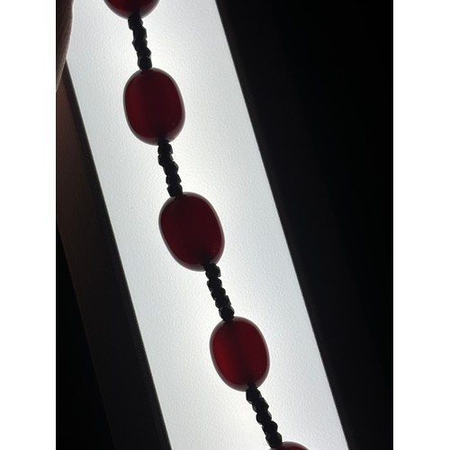 1256 - A Vintage single-row graduated cherry amber bead necklace, amber measures 20.7-9.3mm, 60cm, 27.4g
