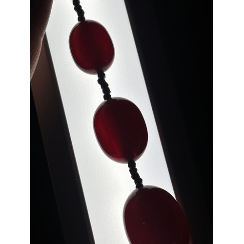 1256 - A Vintage single-row graduated cherry amber bead necklace, amber measures 20.7-9.3mm, 60cm, 27.4g