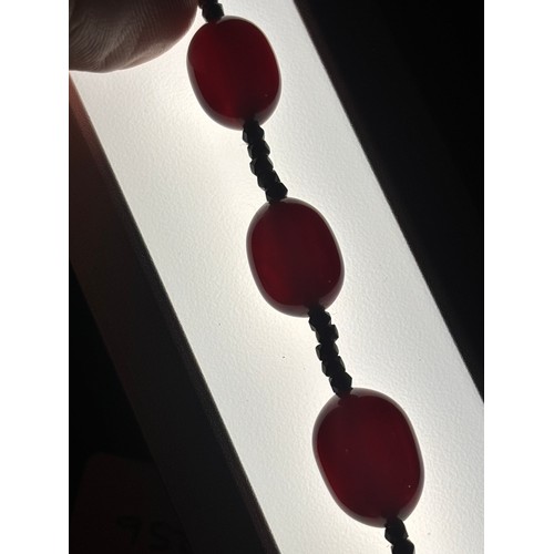 1256 - A Vintage single-row graduated cherry amber bead necklace, amber measures 20.7-9.3mm, 60cm, 27.4g