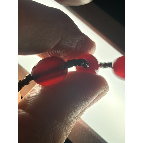 1256 - A Vintage single-row graduated cherry amber bead necklace, amber measures 20.7-9.3mm, 60cm, 27.4g
