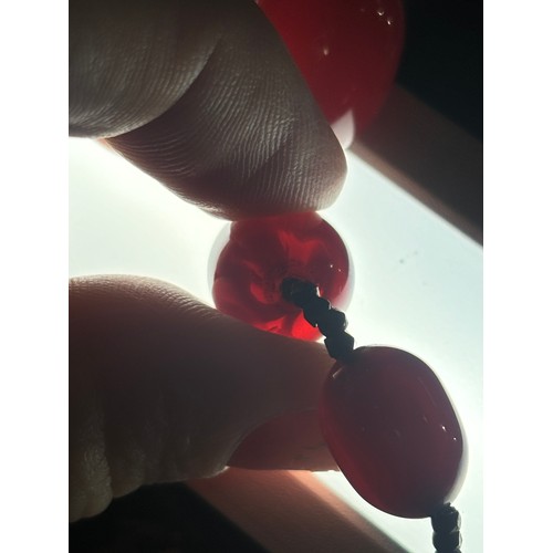 1256 - A Vintage single-row graduated cherry amber bead necklace, amber measures 20.7-9.3mm, 60cm, 27.4g