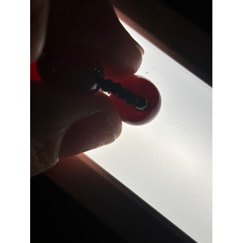 1256 - A Vintage single-row graduated cherry amber bead necklace, amber measures 20.7-9.3mm, 60cm, 27.4g