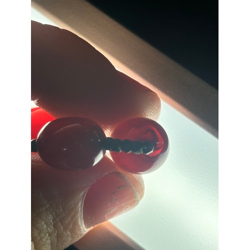 1256 - A Vintage single-row graduated cherry amber bead necklace, amber measures 20.7-9.3mm, 60cm, 27.4g