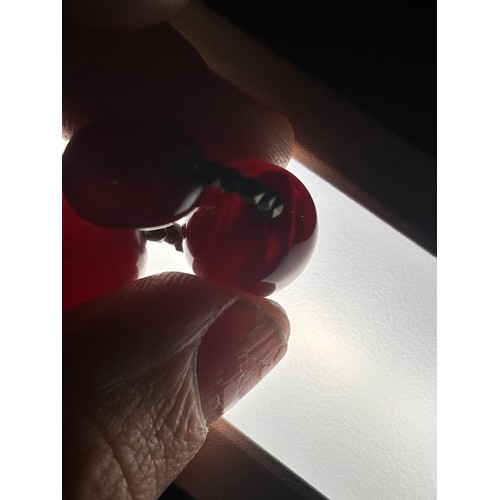 1256 - A Vintage single-row graduated cherry amber bead necklace, amber measures 20.7-9.3mm, 60cm, 27.4g