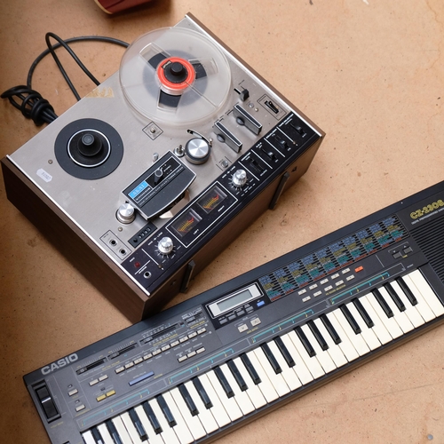 A Casio CZ-230S digital programmable programmed synthesizer, and