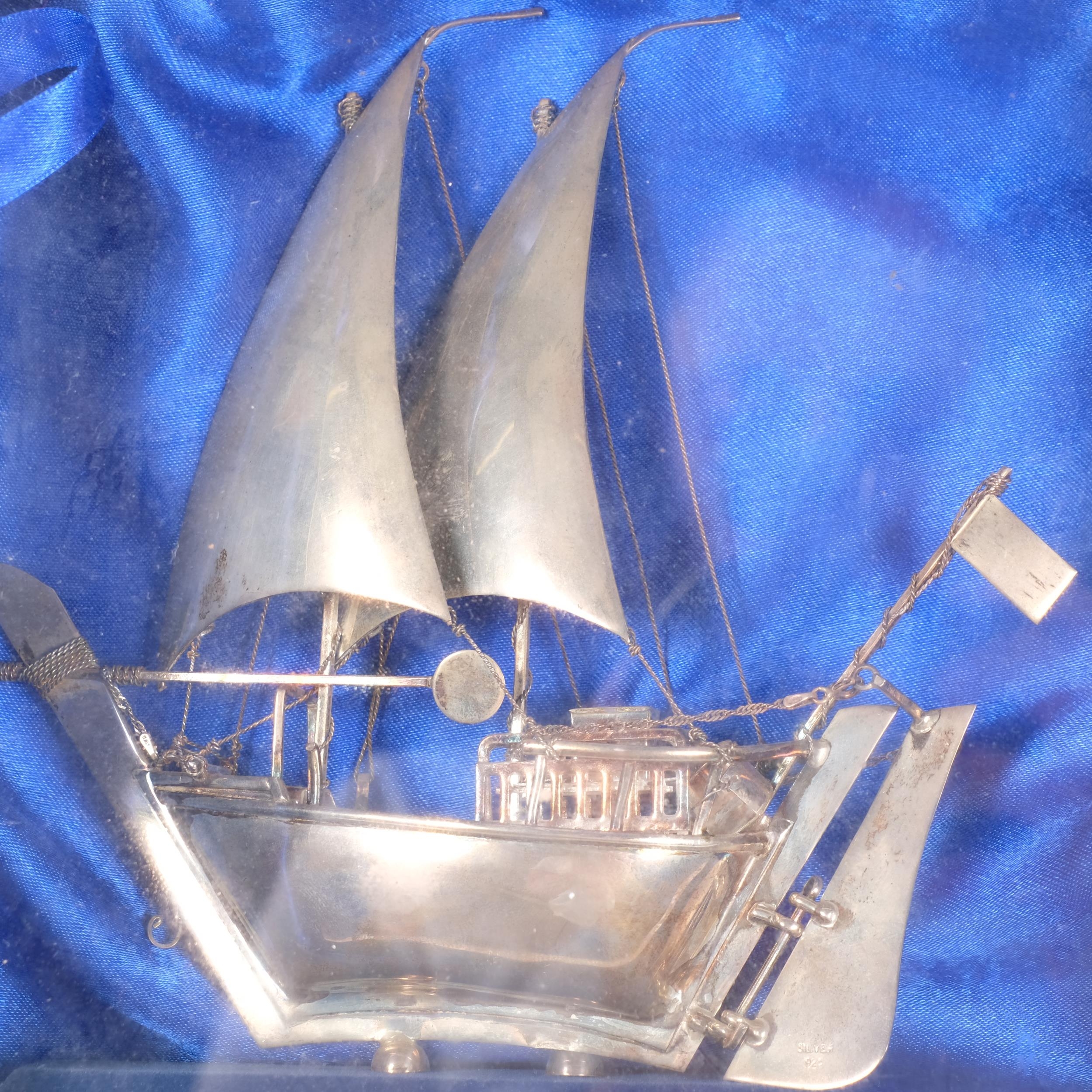 A Middle Eastern sterling silver model dhow sailing ship on stand ...