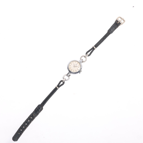 1025 - BUCHERER - a lady's Vintage stainless steel mechanical wristwatch, circa 1960s, silvered dial with b... 