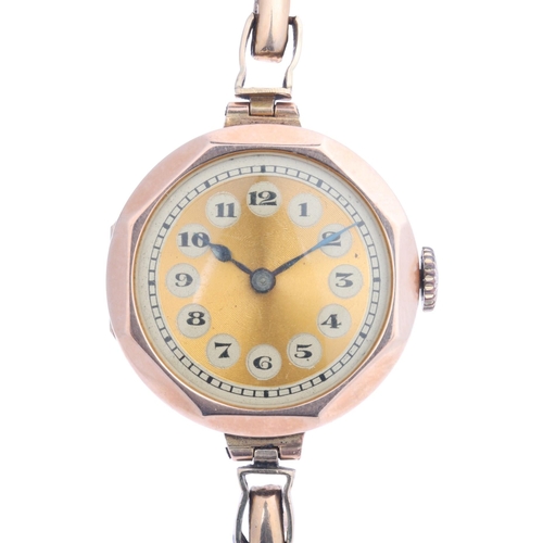 1029 - A lady's 9ct rose gold mechanical bracelet watch, gilt dial with black Arabic numerals, blued steel ... 