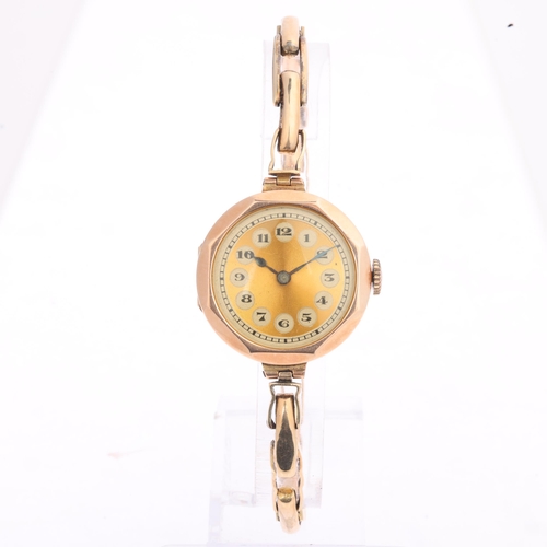 1029 - A lady's 9ct rose gold mechanical bracelet watch, gilt dial with black Arabic numerals, blued steel ... 