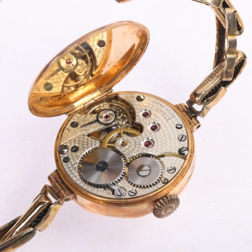 1029 - A lady's 9ct rose gold mechanical bracelet watch, gilt dial with black Arabic numerals, blued steel ... 