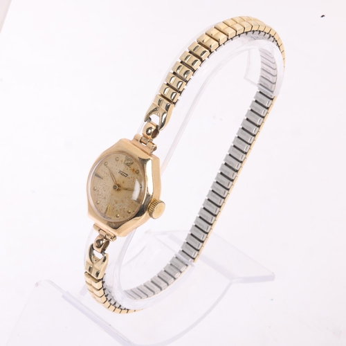 1031 - TISSOT - a lady's Vintage 9ct gold mechanical bracelet watch, silvered dial with gilt teardrop hour ... 