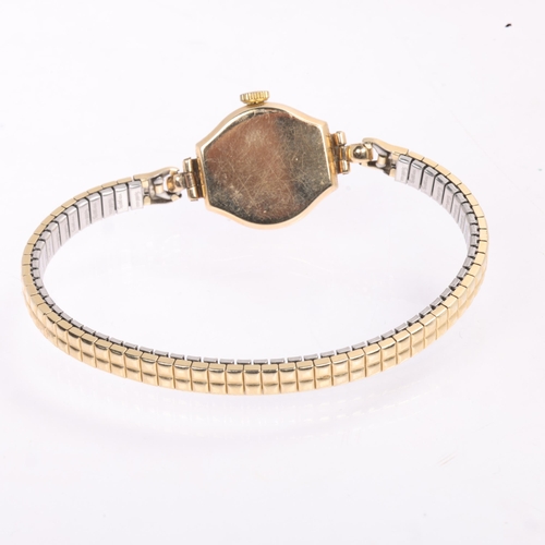 1031 - TISSOT - a lady's Vintage 9ct gold mechanical bracelet watch, silvered dial with gilt teardrop hour ... 