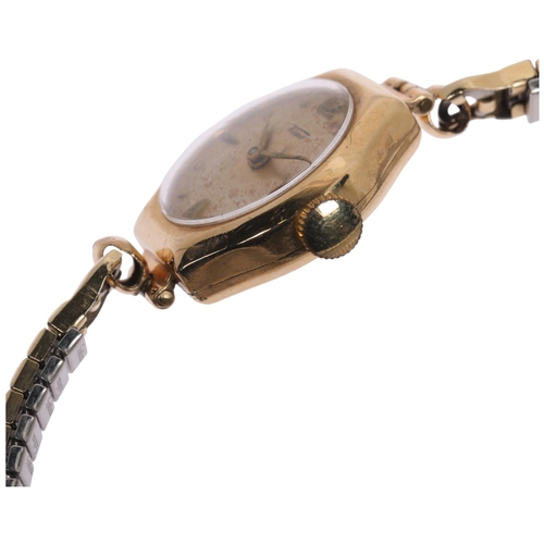 1031 - TISSOT - a lady's Vintage 9ct gold mechanical bracelet watch, silvered dial with gilt teardrop hour ... 