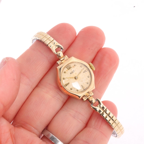 1031 - TISSOT - a lady's Vintage 9ct gold mechanical bracelet watch, silvered dial with gilt teardrop hour ... 