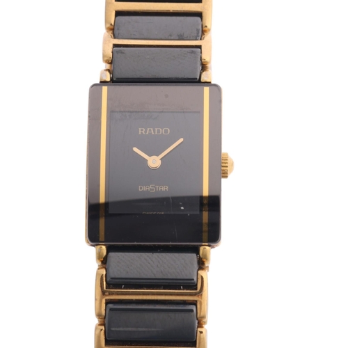 1034 - RADO - a lady's gold plated black Hi-Tech ceramic Diastar quartz bracelet watch, ref. 153.0283.3N, b... 
