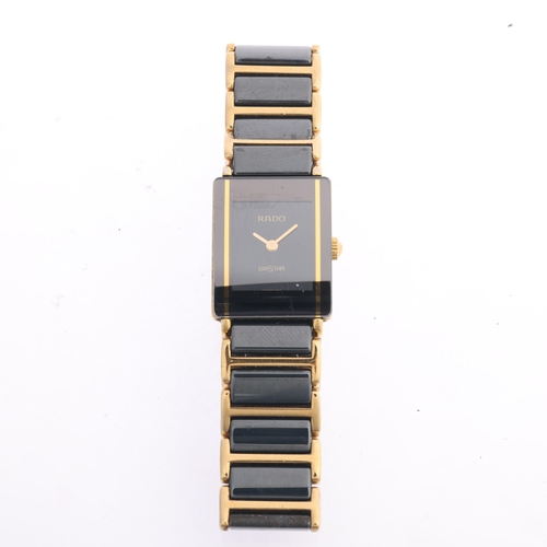 1034 - RADO - a lady's gold plated black Hi-Tech ceramic Diastar quartz bracelet watch, ref. 153.0283.3N, b... 