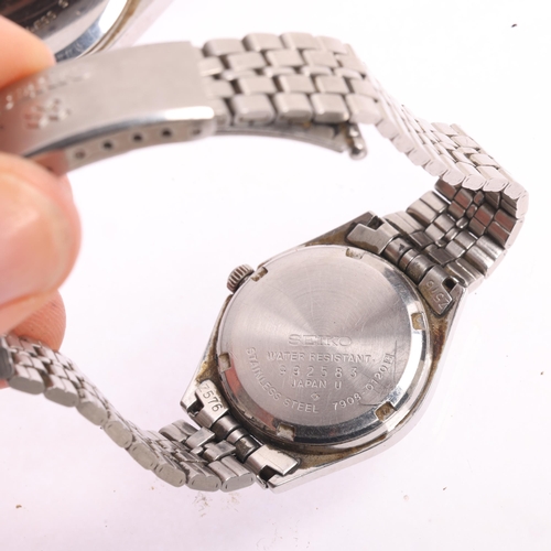 1056 - SEIKO - a pair of 'His And Hers' stainless steel SQ quartz calendar bracelet watches, ref. 7123-8430... 