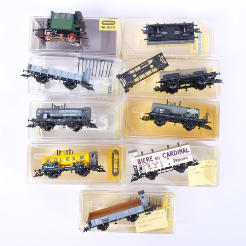 12 - A collection of 9 various HO gauge wagons and freighters, mostly Trix, the vendor noting a genuine S... 