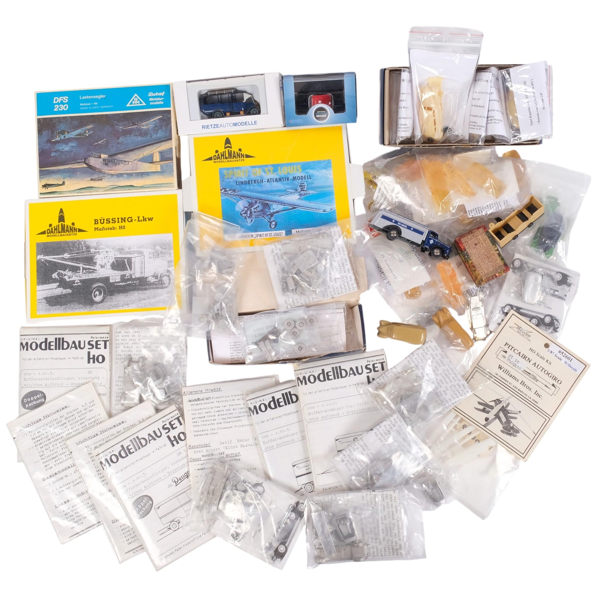 A collection of various flat-pack scale model kits, including Deugro ...