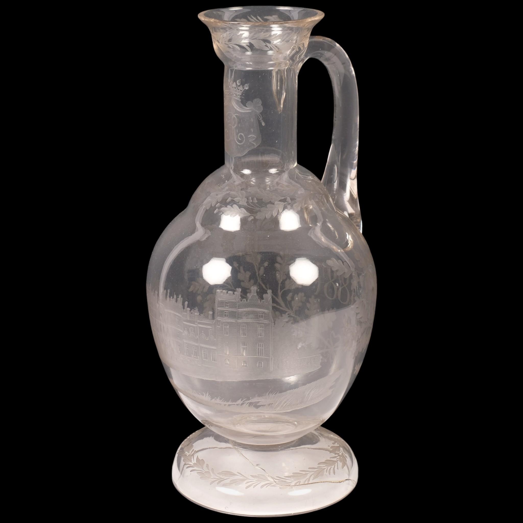 ROYAL INTEREST - A 19th century glass water ewer, with wheel-cut design ...