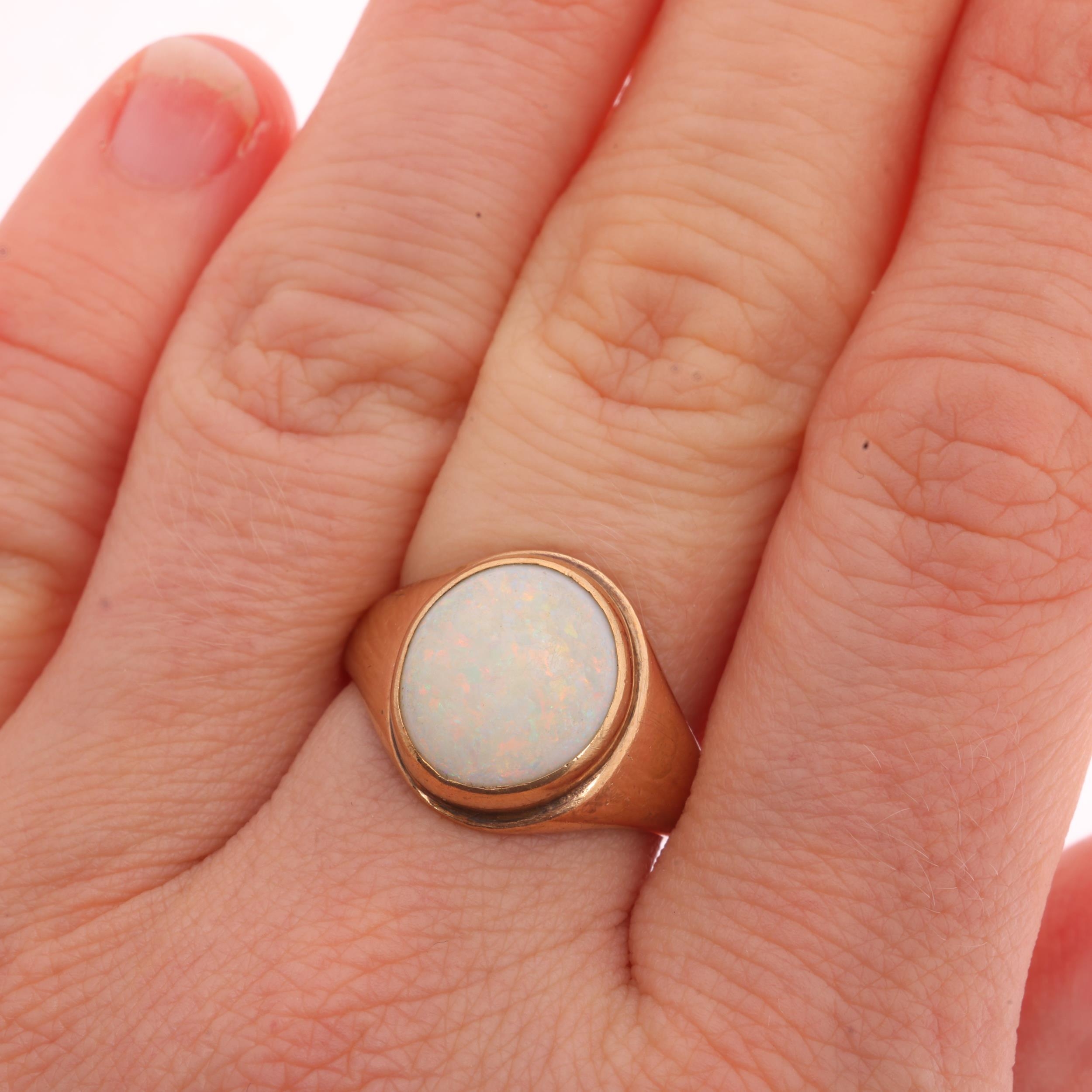 A 9ct rose gold single stone opal signet ring, maker HS, Birmingham ...