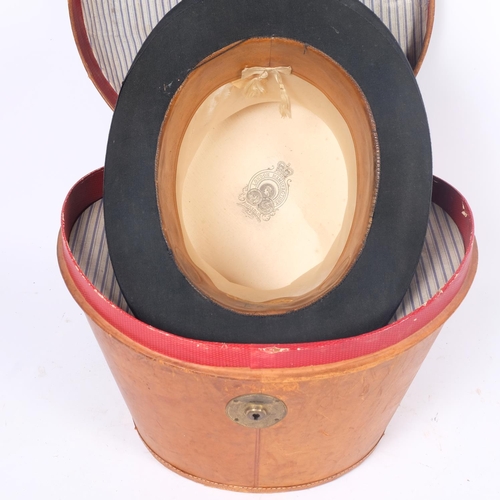 68 - A Victorian and leather hat box, together with a black top hat, London Manufacturer, Durable, intern... 