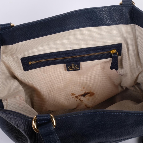 A lady's Gucci inspired blue leather shoulder bag, label for Gucci made ...