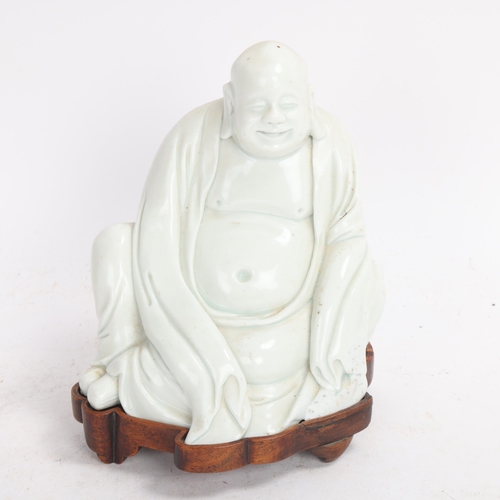 365 - A Chinese blanc de chine porcelain figure of Budai, on original fitted wood stand, height 14.5cm