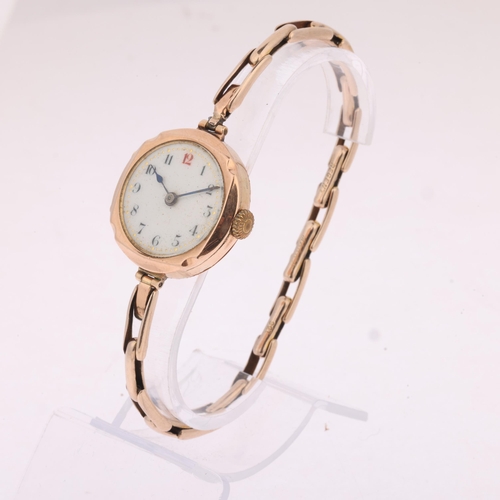 1024 - A 9ct gold mechanical bracelet watch, circa 1920, white enamel dial with black and red Arabic numera... 